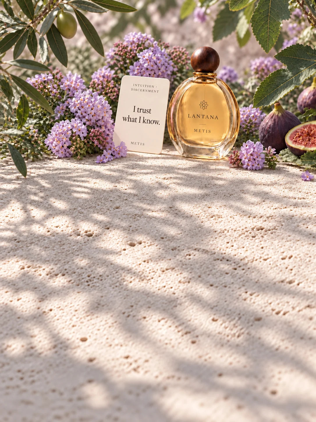 METIS perfume bottle and its Intuition and Discernment intention card with lavender lantana and figs in a cool, shaded Mediterranean garden.